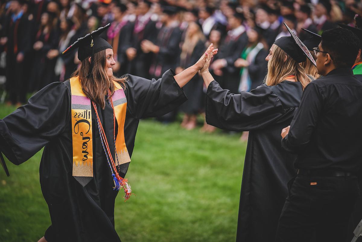 Students celebrating at graduation